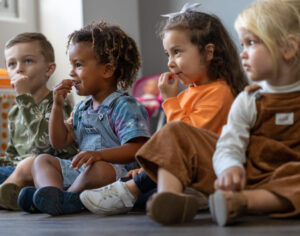 children participating in a play based key word signing program